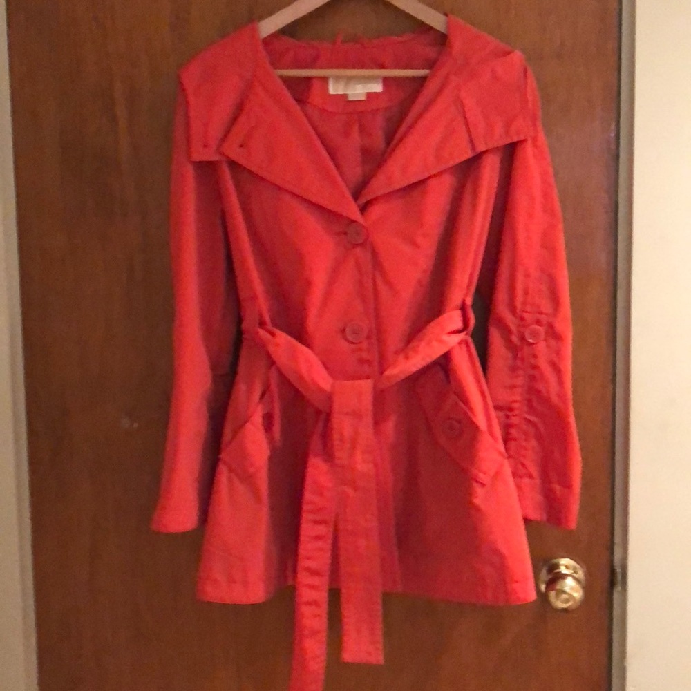 Orange Michael Kors belted raincoat